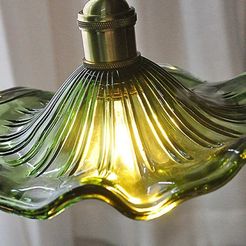A single-head green lotus and leaf pendant lamp in the bedroom, dining room, bar counter and entrance hall of the homestay with