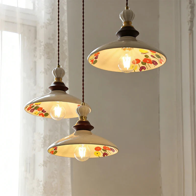 Retro medieval-style hand-painted small flower-patterned ceramic pendant lights for the cream-colored French-style restaurant en